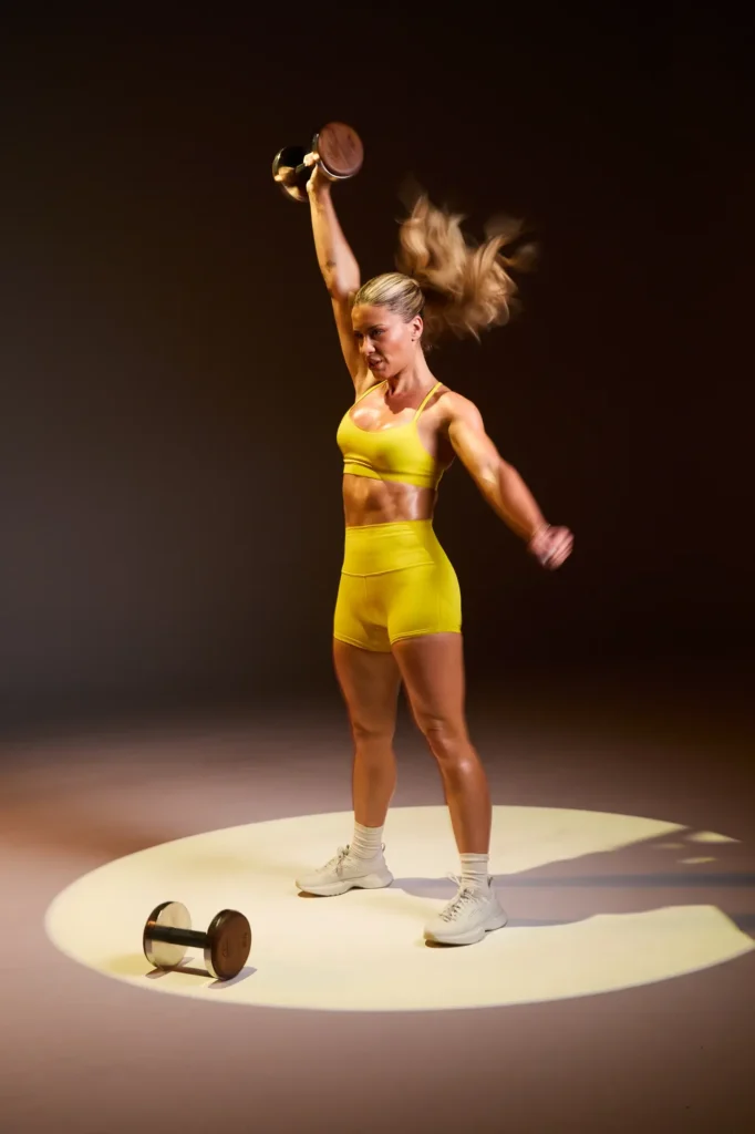 Kendall Toole lifts a dumbbell