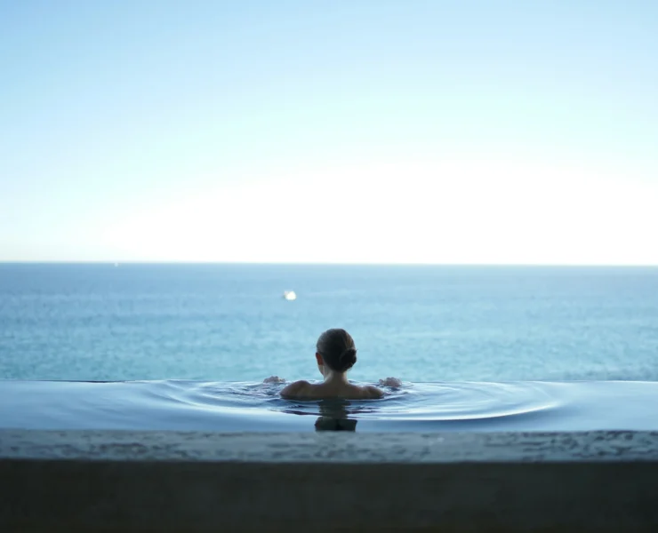 man in an infinity pool