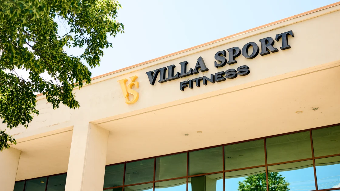 Exterior of a VillaSport Fitness club with the brand’s signage visible above the entrance on a sunny day.
