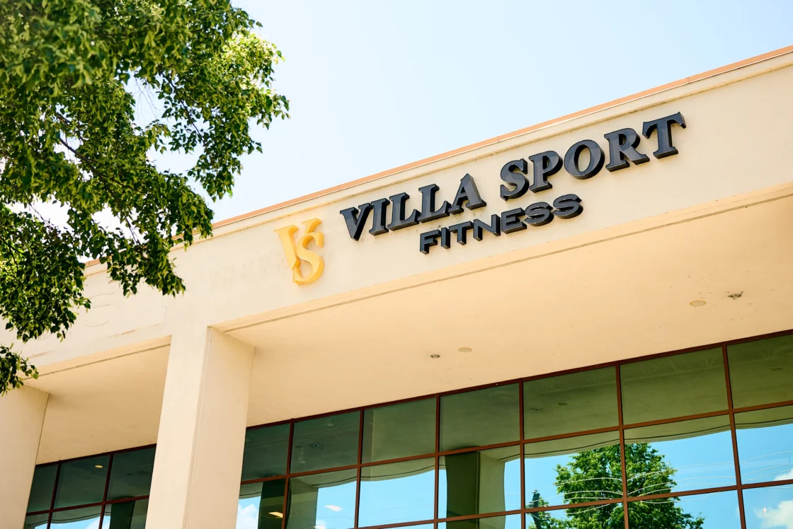 Exterior of a VillaSport Fitness club with the brand’s signage visible above the entrance on a sunny day.