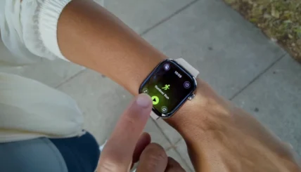 woman uses her Apple Watch