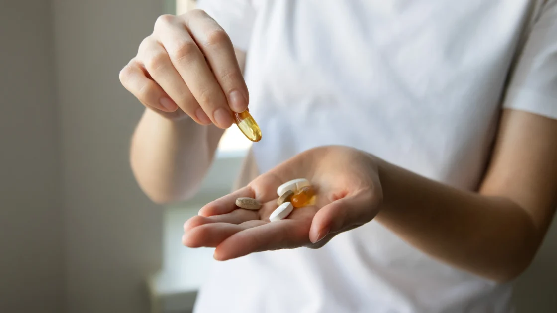 woman holding supplements