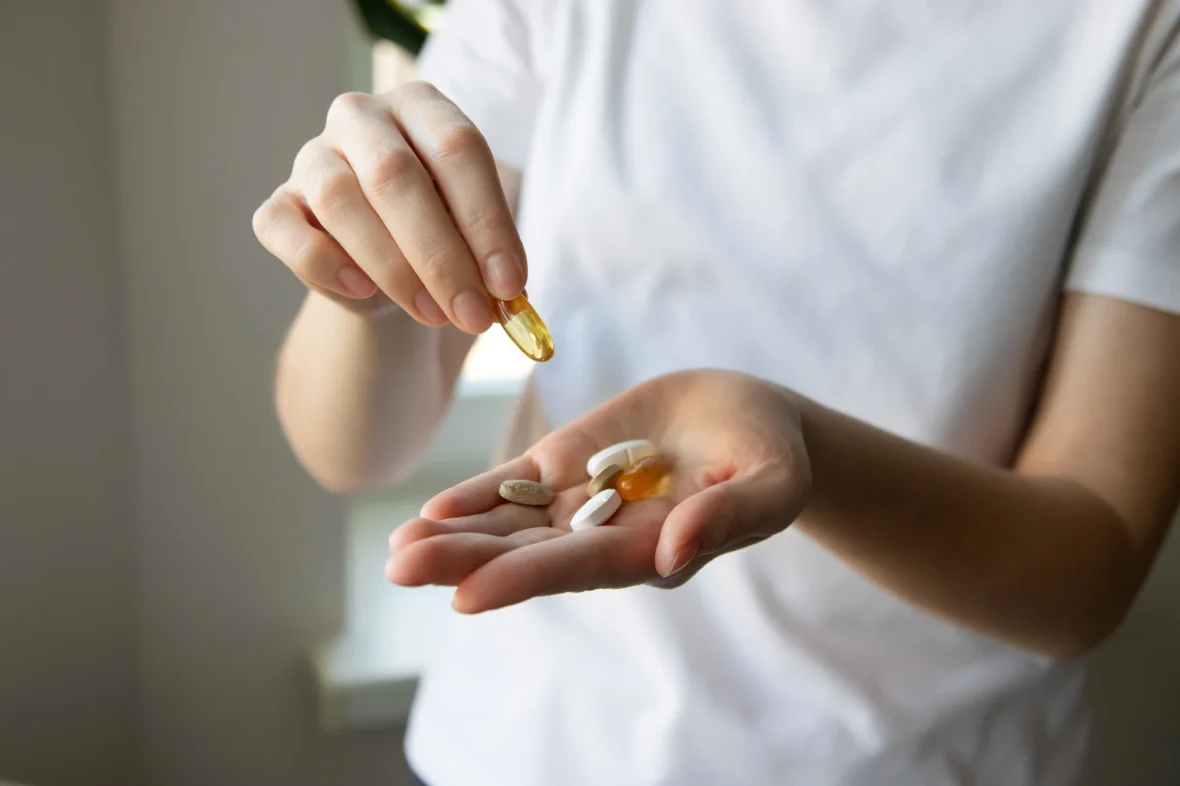 woman holding supplements
