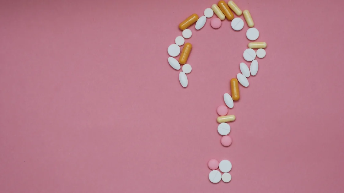 supplement pills form a question mark