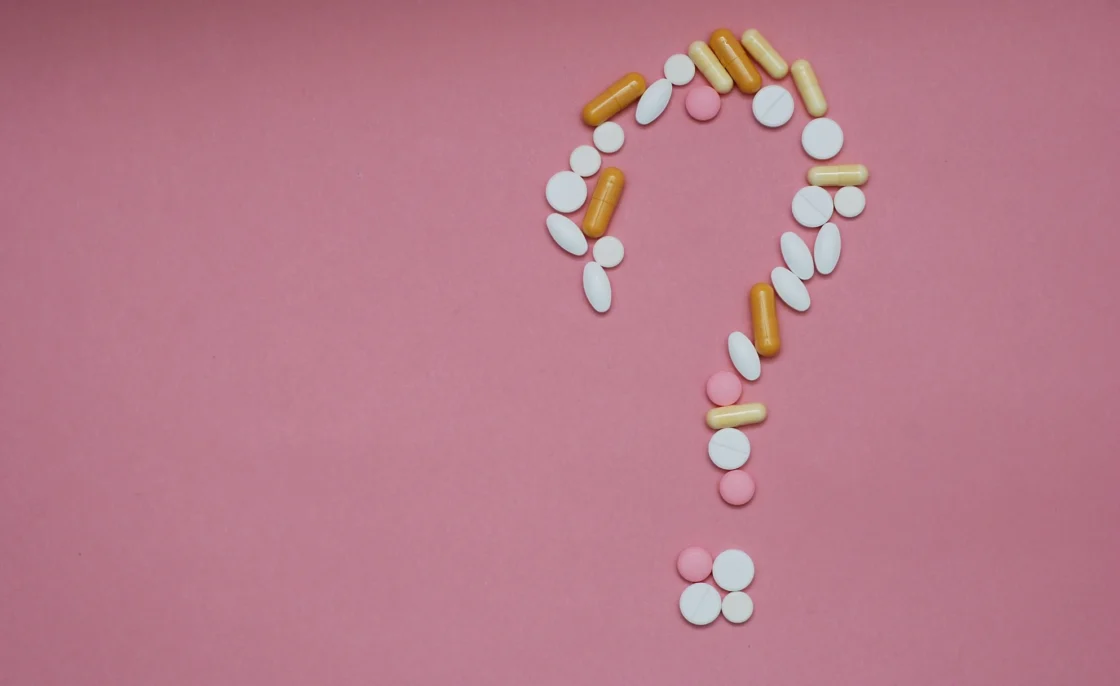 supplement pills form a question mark