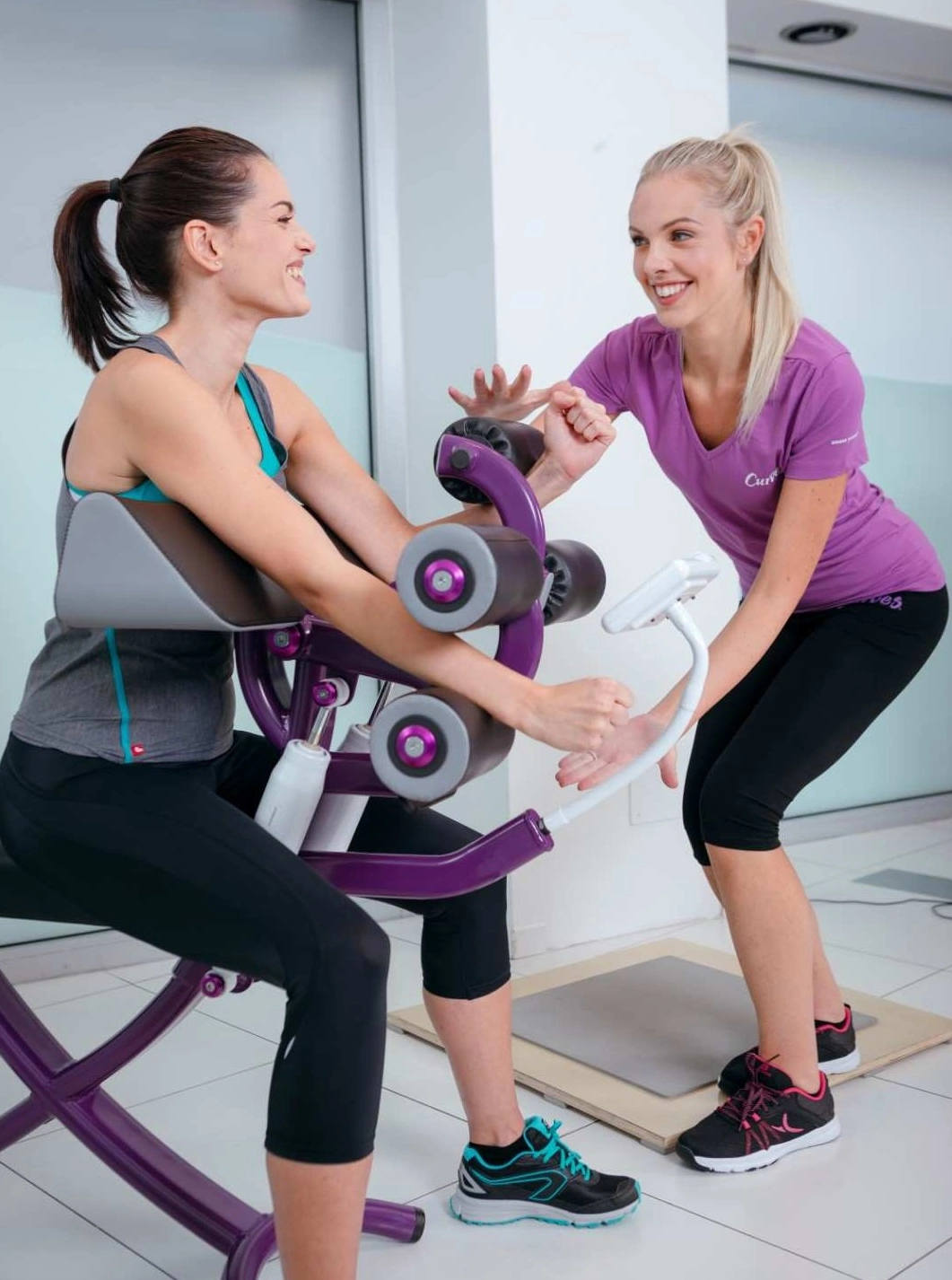 women work out at a Curves gym