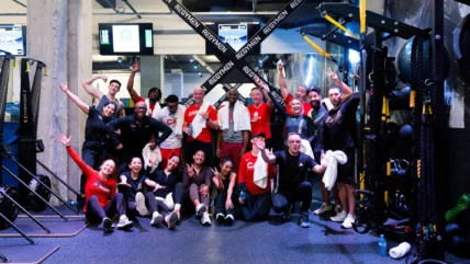 Canada basketball players and GoodLife Fitness staffers pose for a photo