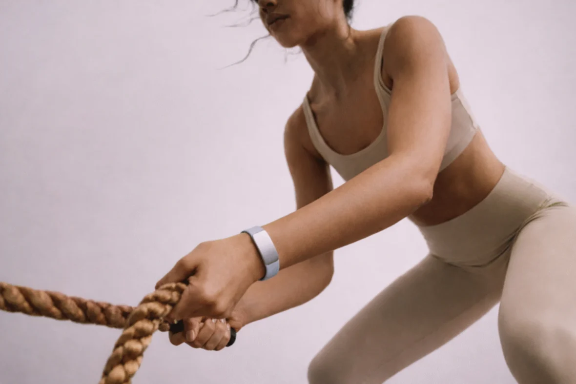 woman wears a Fort strength training wearable