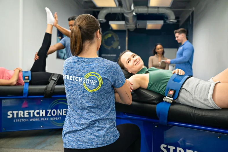 Stretch Zone trainer stretches a client