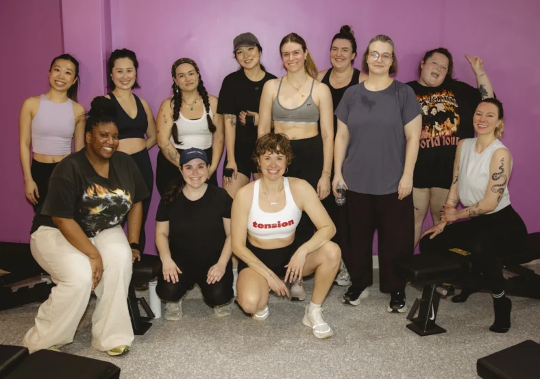 women pose for a photo inside Tension