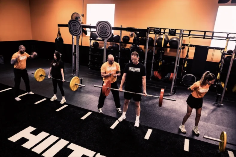 people workout inside a Crunch Fitness gym