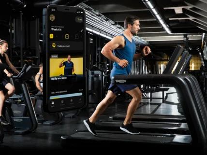 man runs on a Technogym treadmill