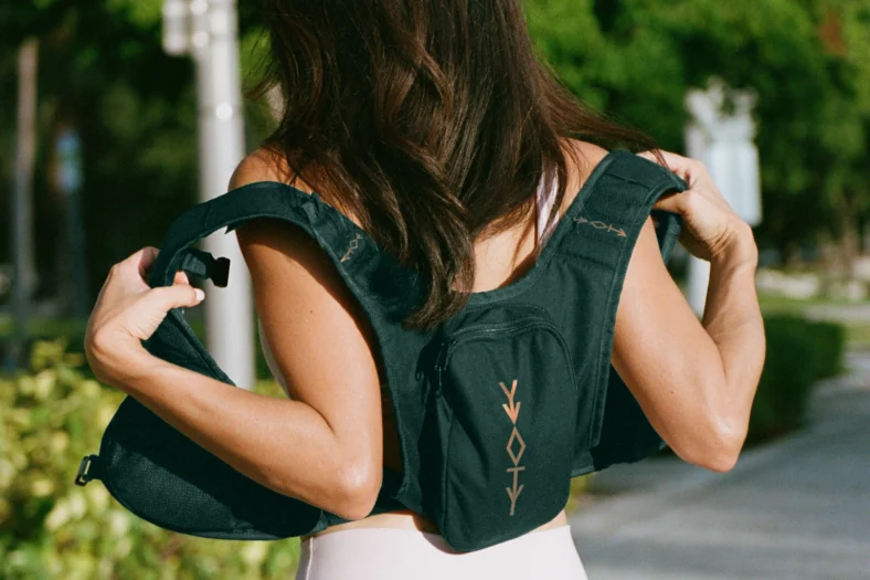 A woman wearing a YVO weighted vest.