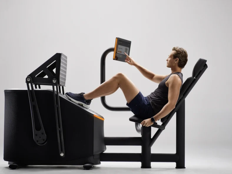 man uses and EGYM machine