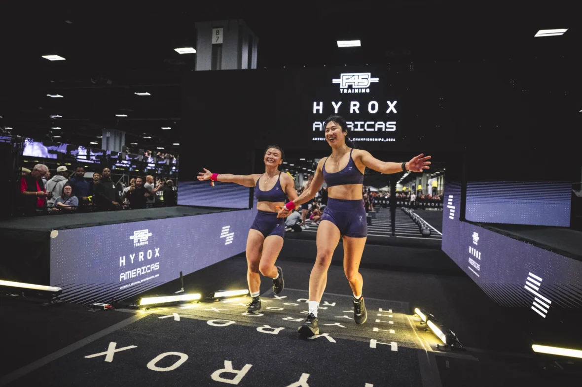 women cross the finish line at a Hyrox event