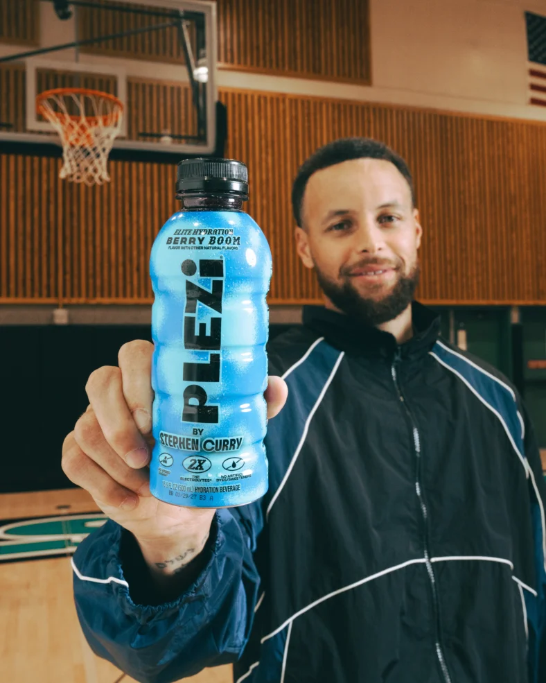 Steph Curry holds a Plezi bottle