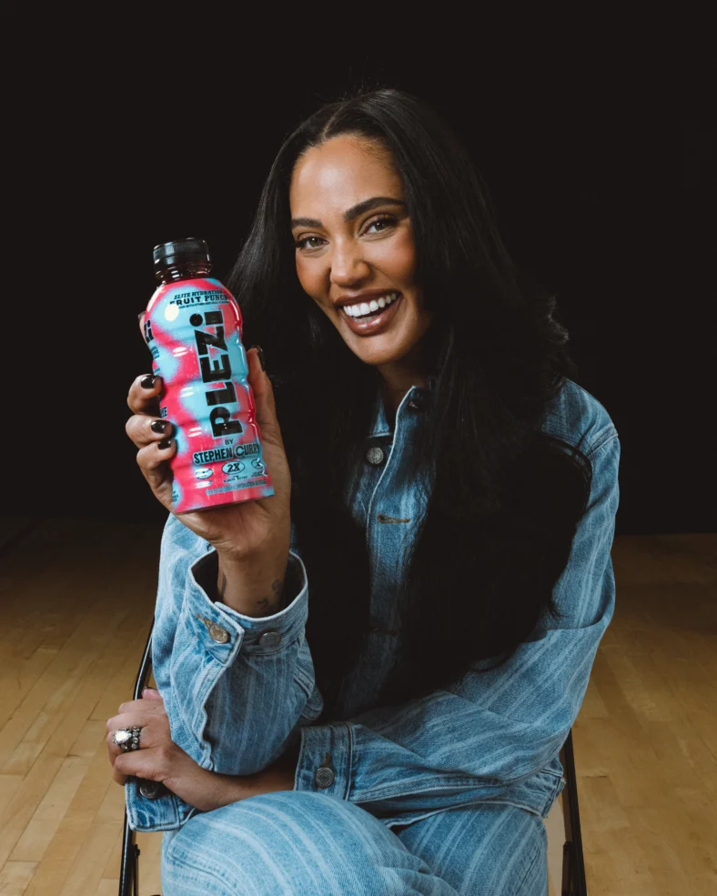 Ayesha Curry holds a Plezi bottle
