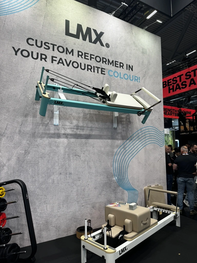 Pilates machine mounted onto a wall at FIBO 2026
