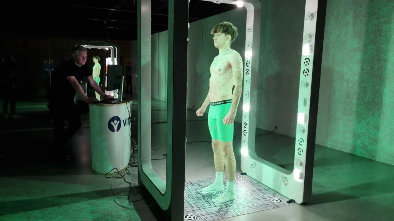 man inside a 3D body scanning machine