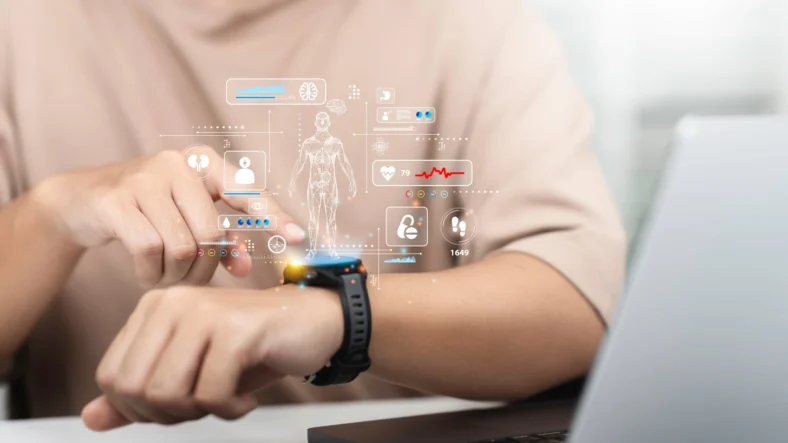 man uses a smartwatch displaying health graphics