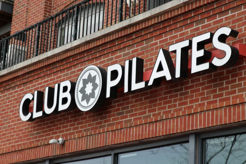 Club Pilates sign on a storefront