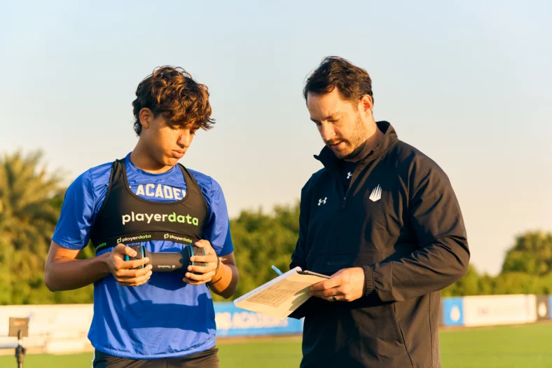 soccer player holds a Therabody thermoregulation device