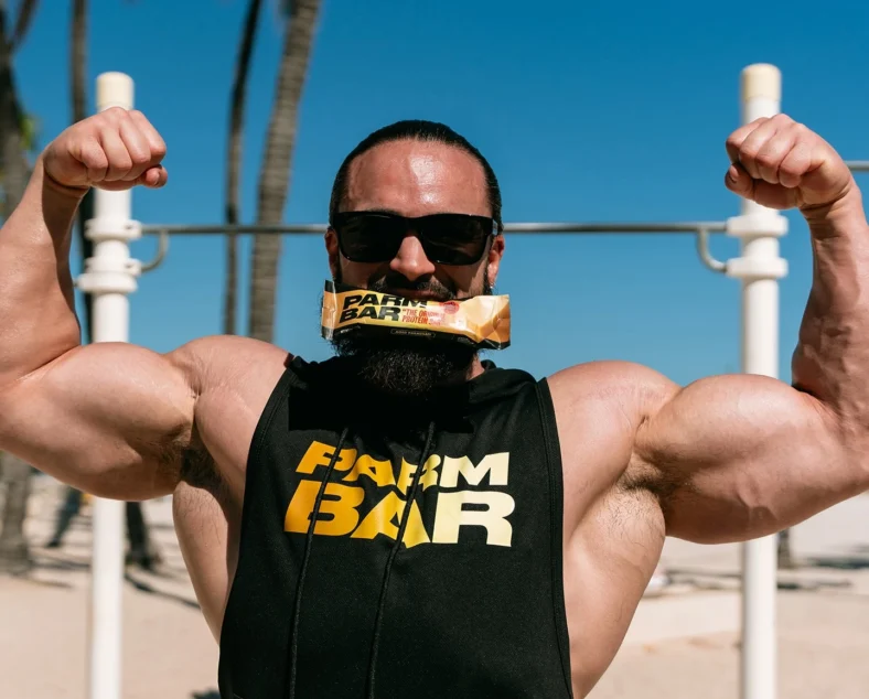 Adrian Williams chews on a Parm Protein bar