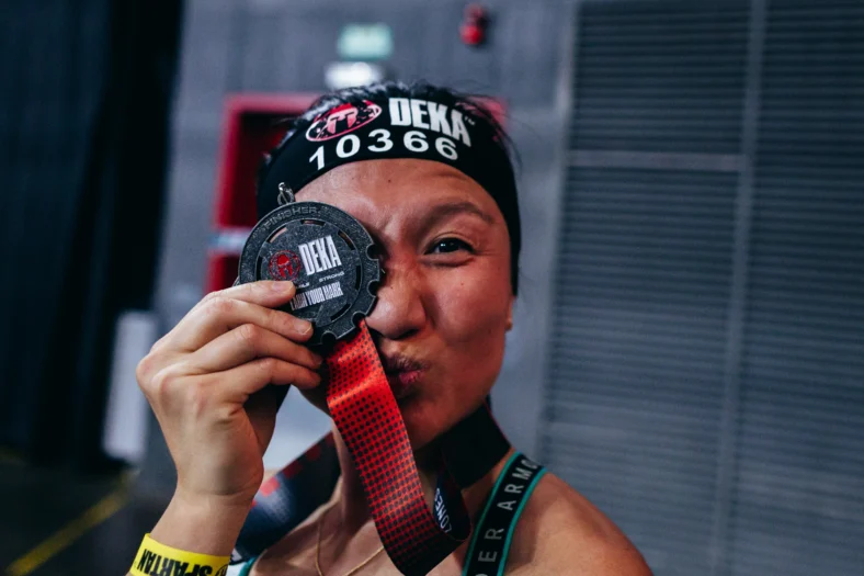 woman with a medal from a fitness competition