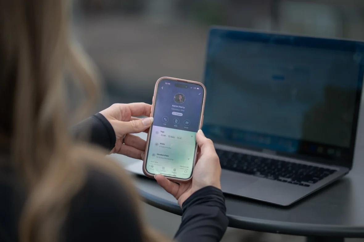 woman holds an iPhone