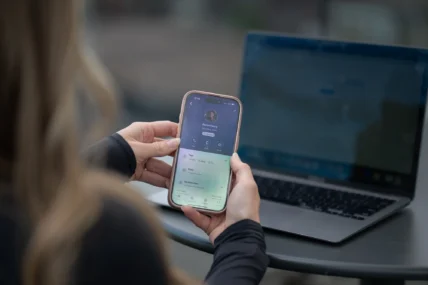 woman holds an iPhone
