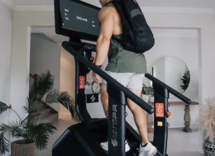 man on a Stepr machine