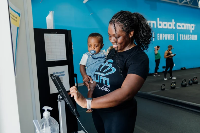 woman with her child at a Burn Boot Camp