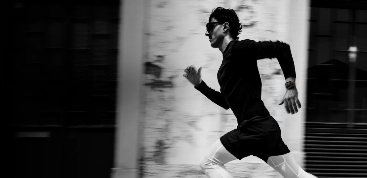 man runs while wearing an Apple Watch