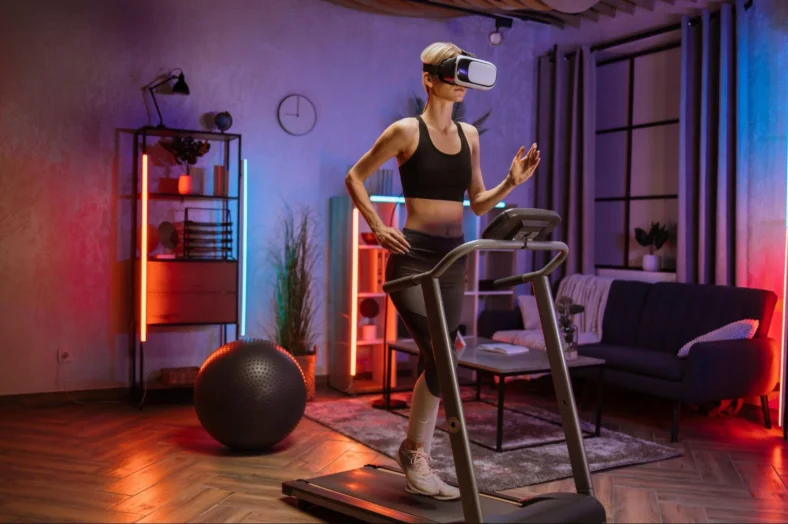 woman on a treadmill wears a VR fitness headset